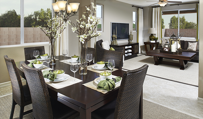 A dining room table and great room staged to sell