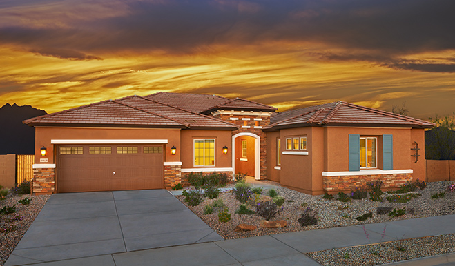 Exterior of ranch-style home at sunset