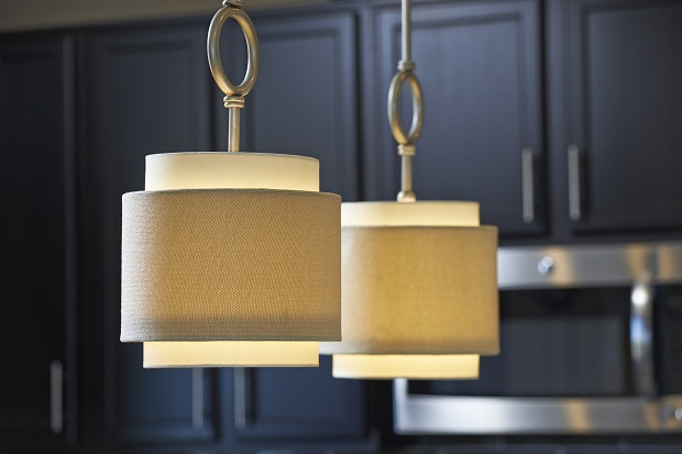 Elegant light fixtures hanging in kitchen