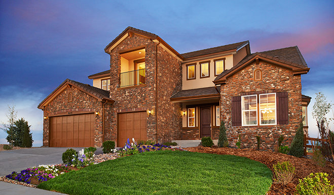 Exterior of two-story home with private balcony and 3-car garage