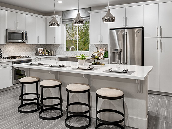 Kitchen with white cabinets and center island