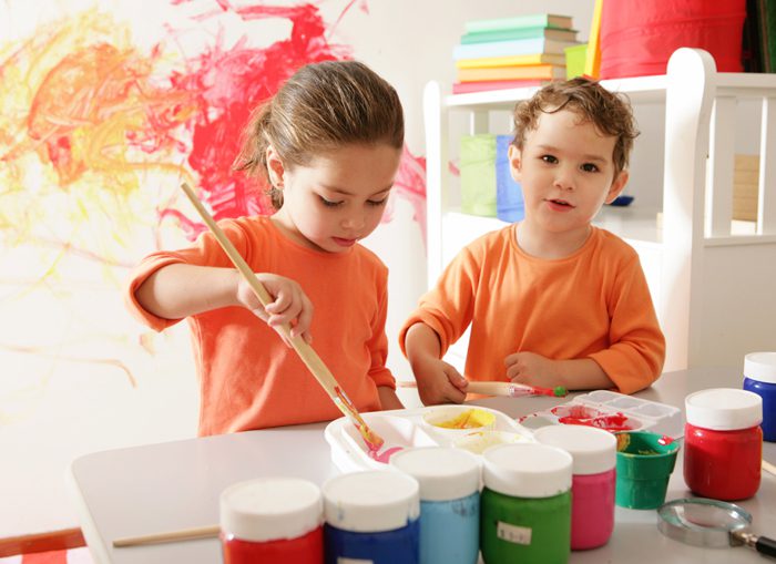 Boy and girl painting