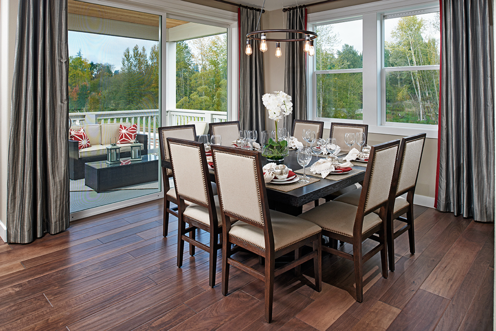 Dining nook with round, bronze chandelier