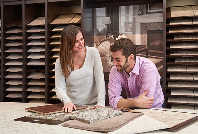 Couple looking at design options at Home Gallery