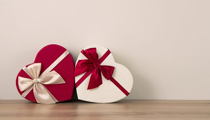 Two heart-shaped boxes containing Valentine's Day gifts