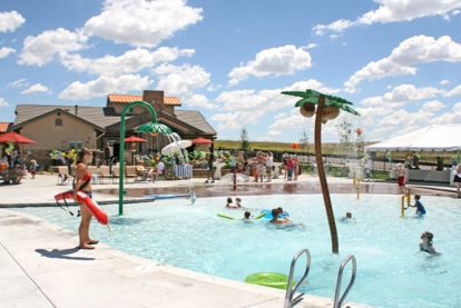 People swimming in community pool