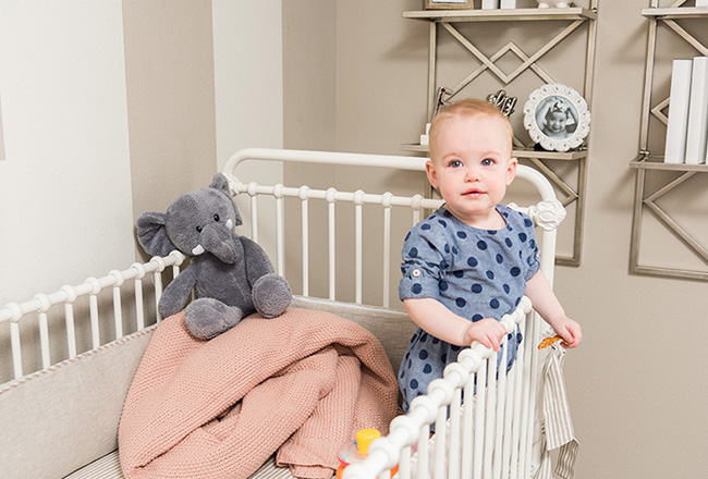 Baby in a white crib