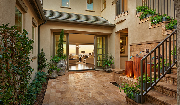 Home courtyard with flooring and several plants