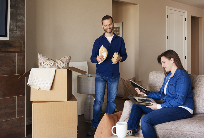 Couple packing in the living room