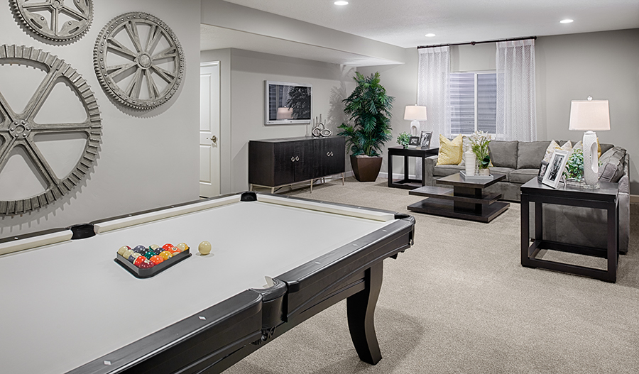 Finished Coronado plan basement with seating area and pool table