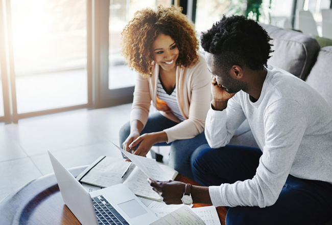 Couple reviewing refinancing documents