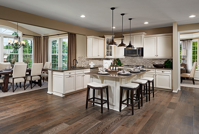 Kitchen with light cabinets and center island