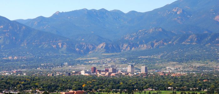 Colorado Springs skyline with mountains towering over