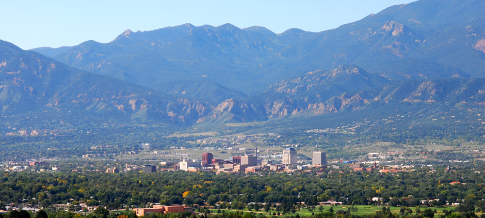Colorado Springs skyline with mountains towering over