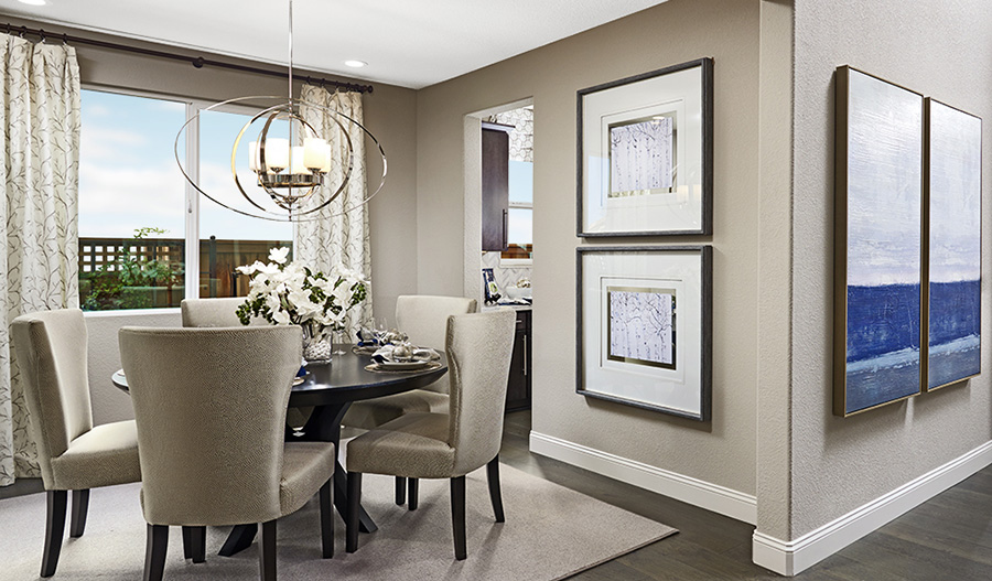 The Caroline chandelier hanging over table in dining room