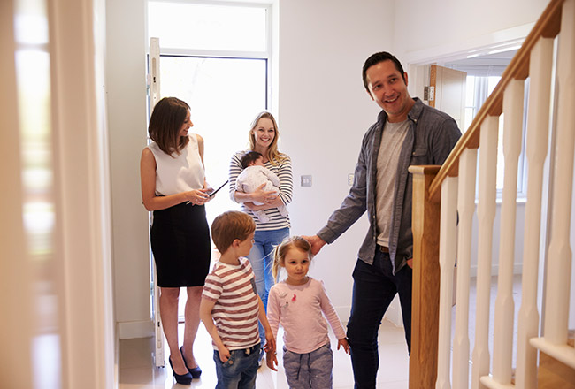 Family inside of entry at an Open House