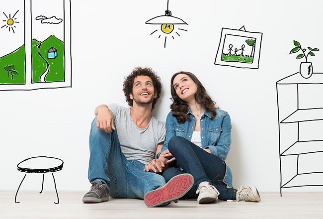 Happy couple sitting on floor of illustrated home