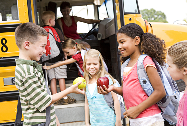 Kids getting onto school bus