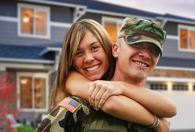 Woman with arms around man in military uniform