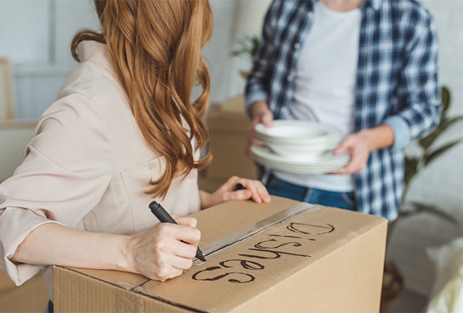 Couple packing boxes