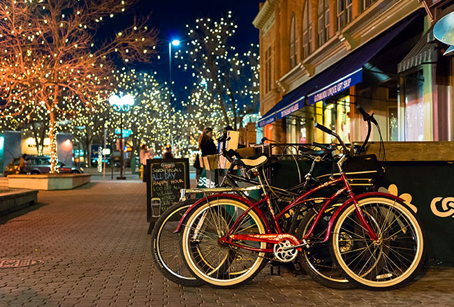 Bicycle resting outside of restaurant