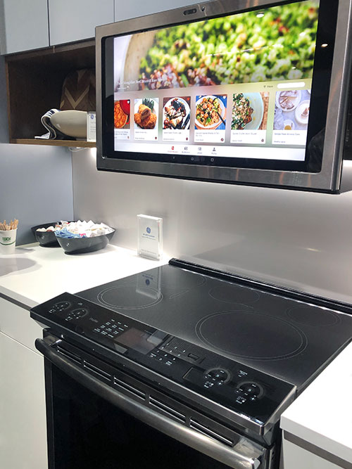 GE® Kitchen Hub™ touch screen and ventilation system mounted over cooktop