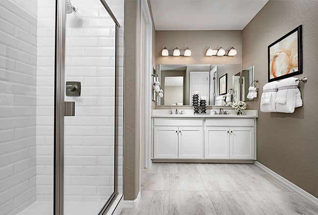 Owner's bath with white subway tile shower