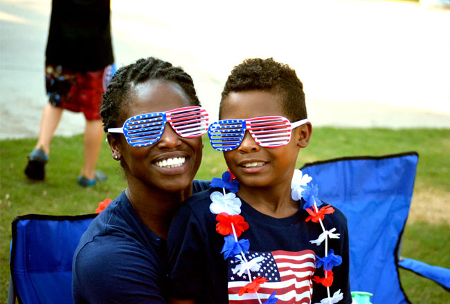 Mother and child wearing patriotic sunglasses