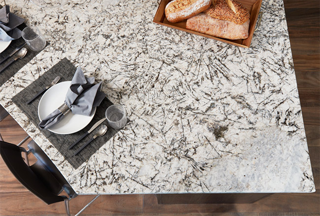 Gray and black natural stone countertop with place setting