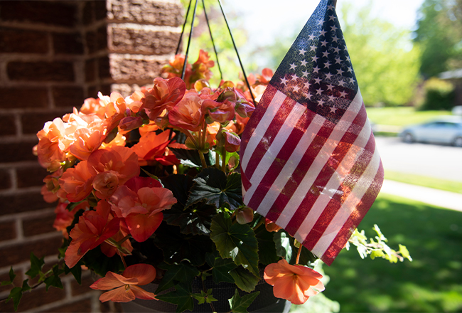 Hanging flower basket with American flag