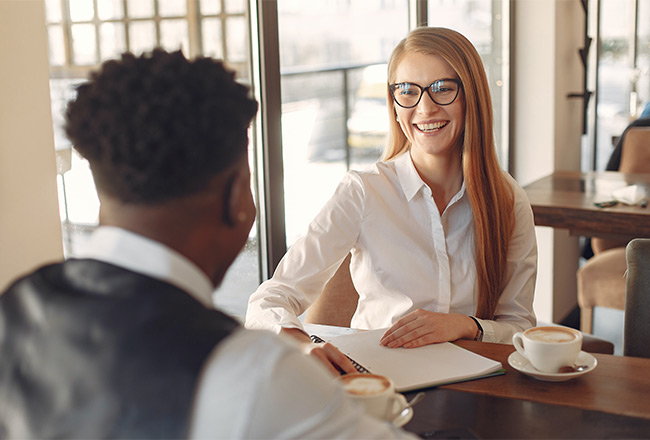 Homebuyer sitting across from loan officer