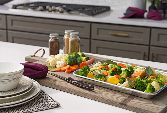 Tray with vegetables on kitchen island