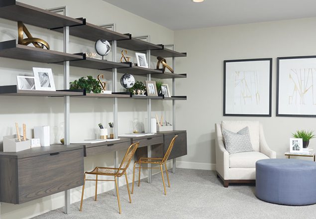 Home office with side-by-side desks and shelves above