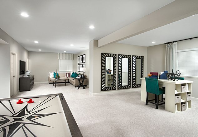 Basement with air hockey table, office area, and sitting area