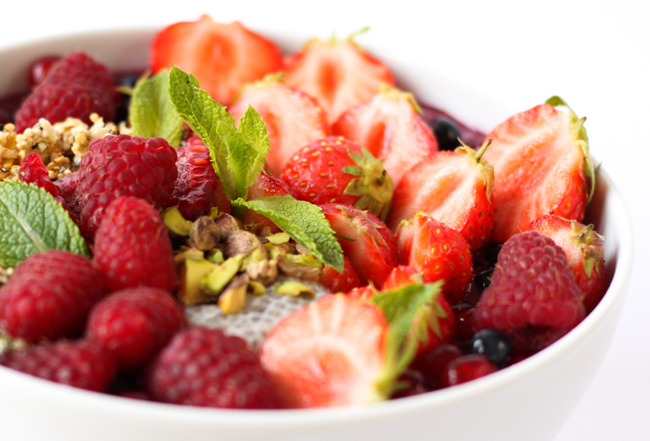 Bowl of strawberries and raspberries, garnished with mint