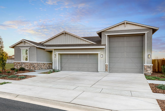 Exterior of a home with an attached RV garage