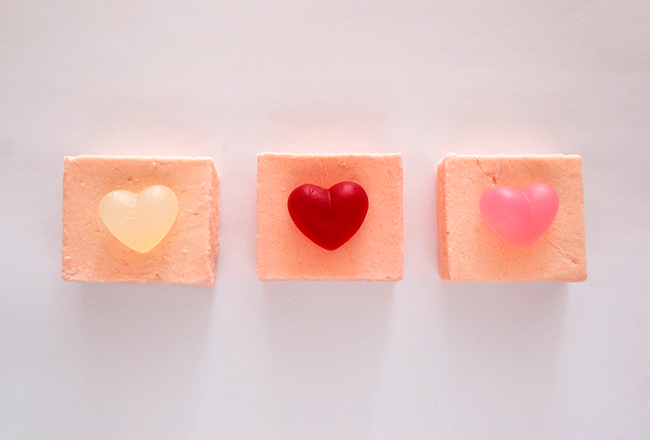 Three petit fours with hearts on them