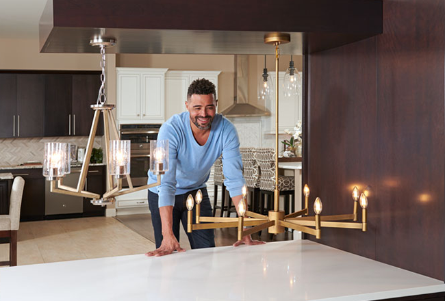 Man looking at two light fixtures