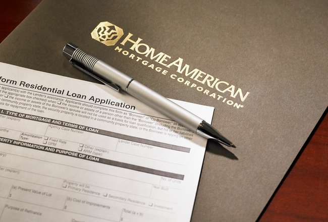HomeAmerican Mortgage loan application with a pen on top