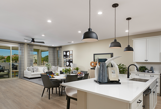 Black pendant lights over kitchen island