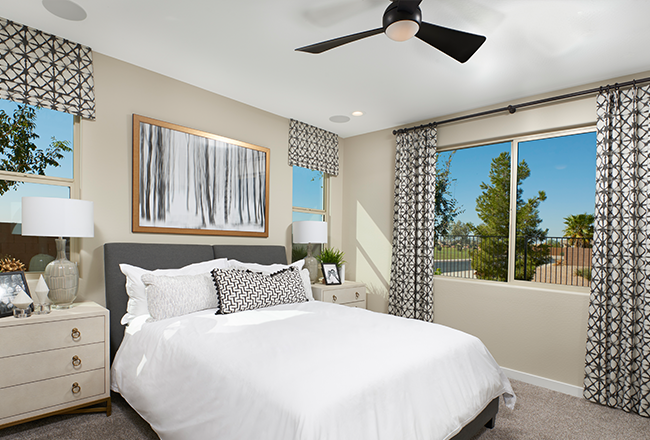 Owner's bedroom with black ceiling fan