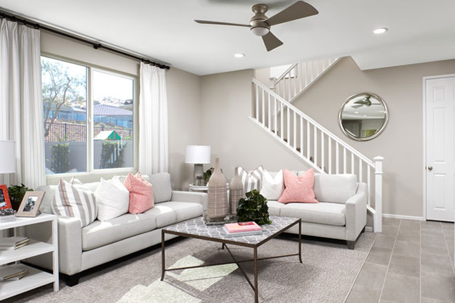 Great room and staircase with white transitional railings