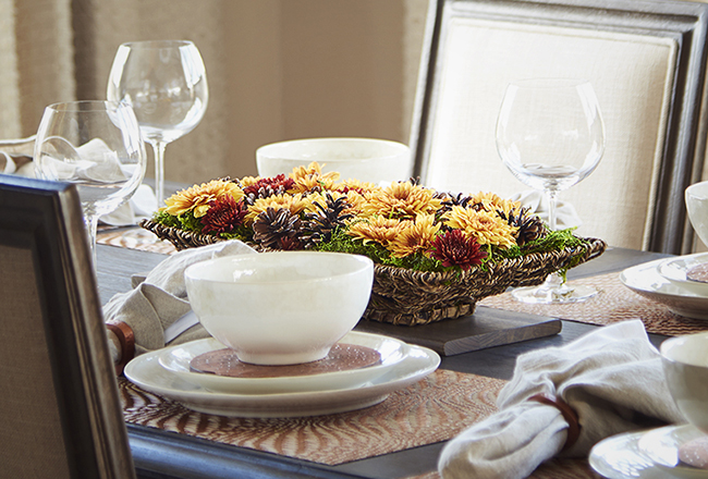 Thanksgiving table with floral fall centerpiece and white place settings