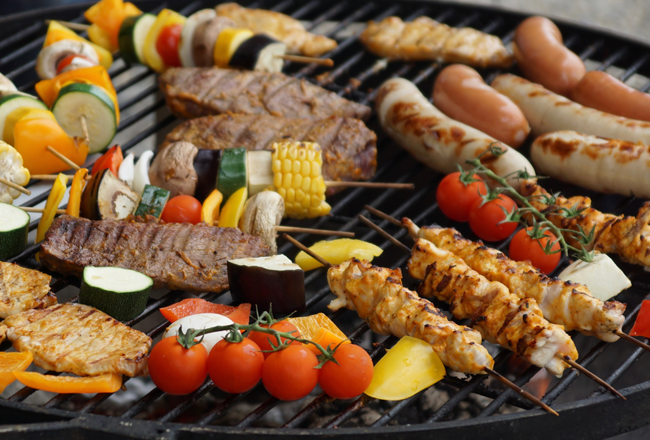 Meats and vegetables on a grill