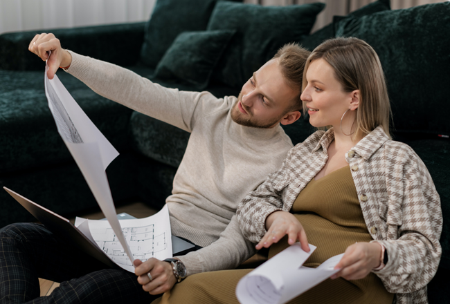 Couple looking at floor plans