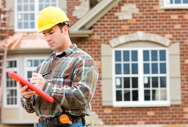 Contractor in front of new home