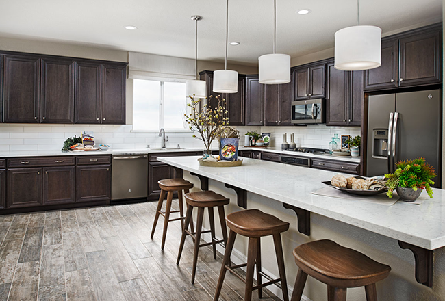 Model home kitchen with laminate wood-look flooring