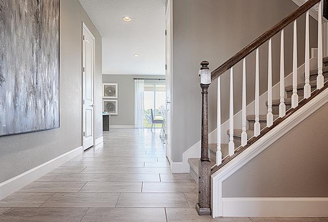 Model home entry with wood-look tile flooring