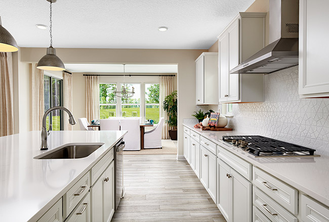 Kitchen with light cabinets and countertops