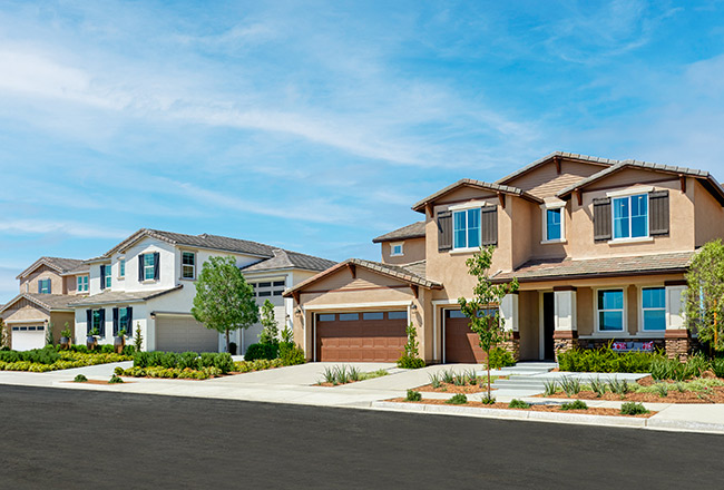 3 two-story Richmond American Homes situated on a sunny street in Southern California